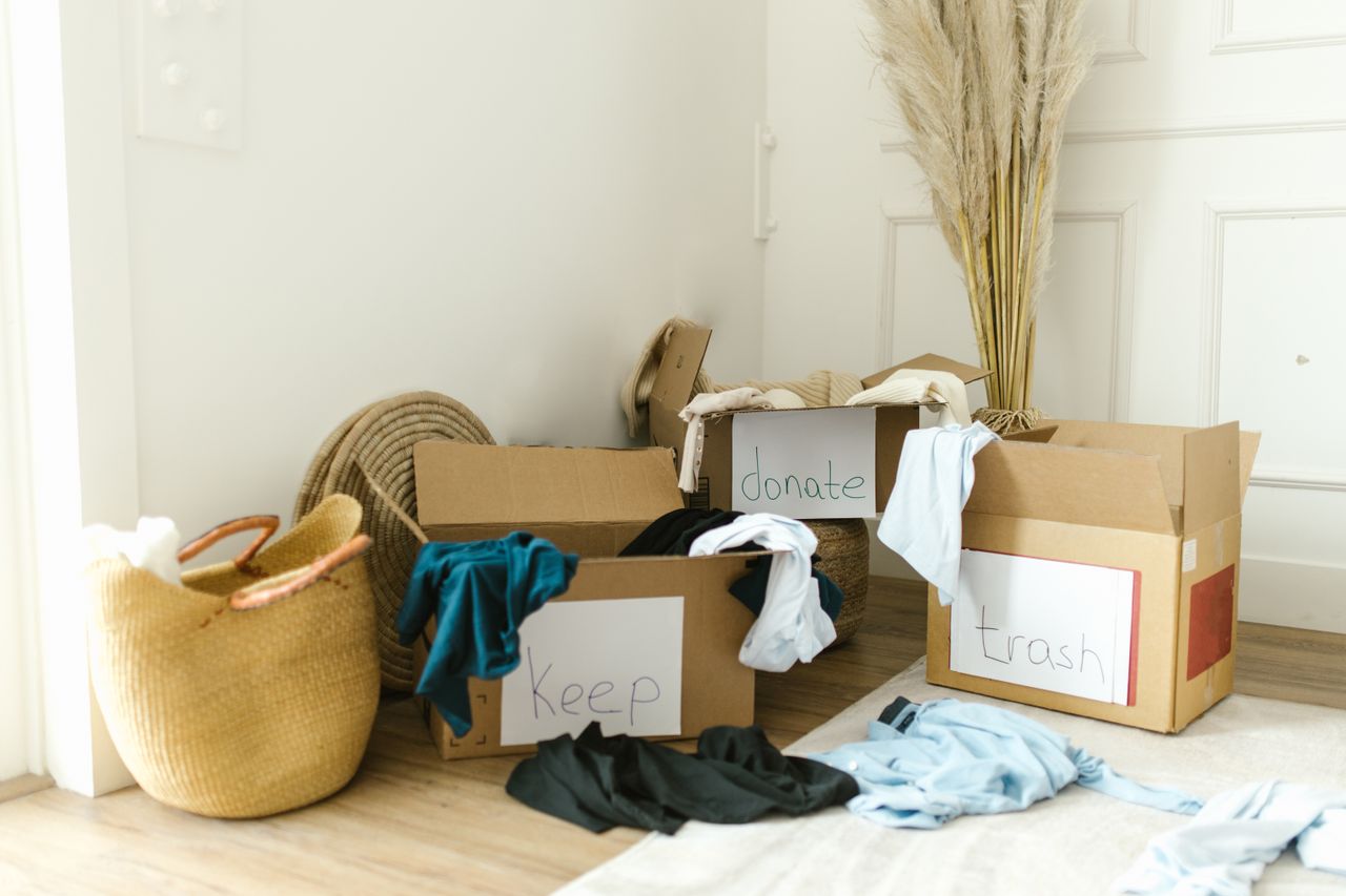 services-01 Cardboard boxes labeled Keep, Donate, and Trash for home decluttering.